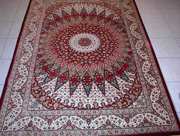 This pure silk Qom Persian rug features another unique variation of the Gombad design, which is the first one like it that I have seen. Due to their popularity, it would not be surprising to see other Persian rugs with the Gombadeh design appearing in the next few years.