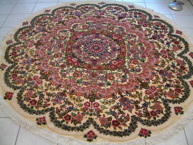 Round Persian Tabriz rug with a metal foundation. Amongst the most valuable and most unusual Persian rugs are the metal rugs, which are most often found in Tabriz rugs. This 7' round rug was one of several metal rugs that I have featured and I would suggest that you look at my metal rug section for more information about these Persian rugs.