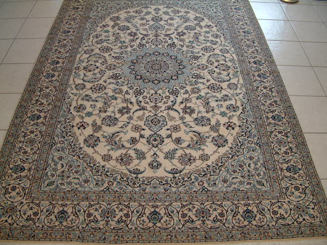 Large Persian Nain rug with a very high 6-lah quality and about 625 kpsi. These type of high end Nain oriental carpets are very popular with my clients and are great examples of what high end Persian rugs should look and feel like. Most high end Nain oriental rugs feature very traditional designs and even though the majority of the Nain Persian carpets are of a much lower quality, it is these high quality Nain Persian rugs, that has given the name the respect it rightfully deserves.