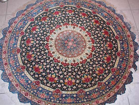 A medium sized Persian Qom rug, which I offered a few years ago. Round pure silk Qom rugs are extremely rare and tend to be very popular with my clients. The colors and design tend to be somewhat similar and I hope to be able to offer more Persian round Qom rugs in the future.