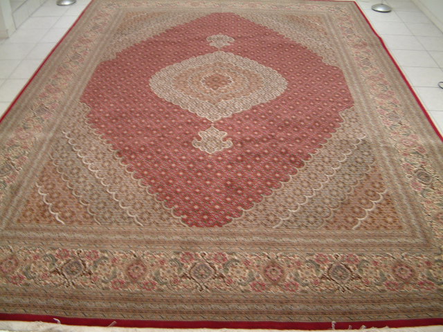 Large Persian Mahi rug with a burgundy color suitable for heavy traffic areas like dining rooms and family rooms.