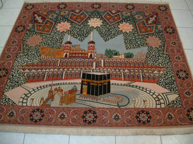 This almost square Tabriz Persian carpet also features a silk foundation and depicts the holy Moslem site of Mecca. As with many spiritual oriental rugs, it is made in a 60 raj quality and the details of the picture look just like a real picture.