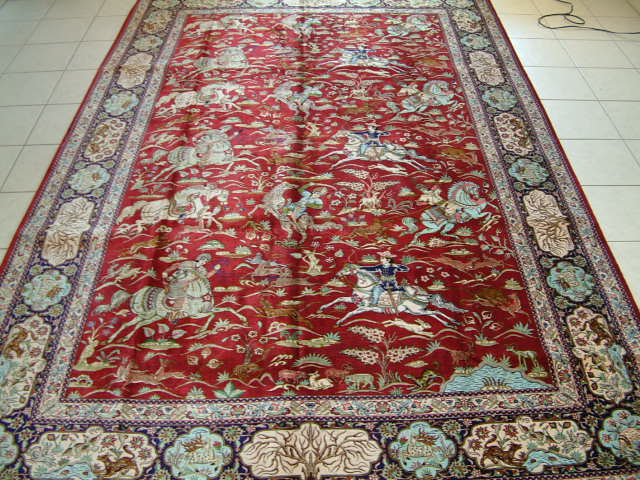 Large picture Qom Persian rug, which like all of my pure silk oriental carpets, is made with over 700 kpsi. It is very rare to see Qom hunting Persian rugs in the large size and in general picture oriental carpets are always much smaller. This is only the second Qom Persian rug with a picture in this large size and all of my other hunting carpets are much smaller.