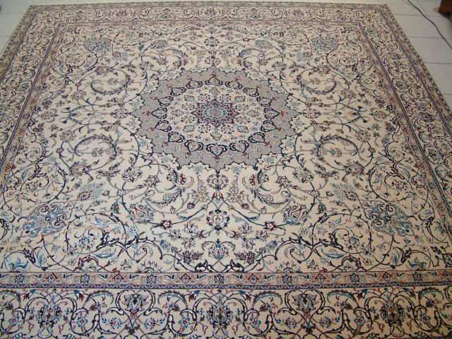Large square Persian Nain rug with a very high 6-lah quality and about 625 kpsi. These type of high end Nain Persian carpets are very popular with my clients and are great examples of what high end oriental rugs should look and feel like. Most high end Nain rugs feature very traditional designs and even though the majority of the Nain carpets are of a much lower quality, it is these high quality Nain Persian rugs, that has given the name the respect it rightfully deserves.