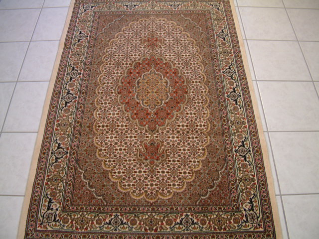 Medium sized Oriental Mahi rug with a beige main color