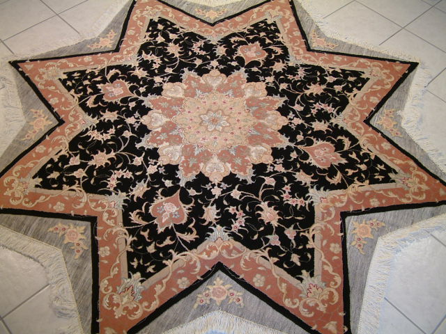 Star-shaped Tabriz Persian carpet and one of my most unusual oriental rugs in my collection. Due to my family's direct connection with many of the Persian rug weavers in Tabriz, I am able to offer rare oriental carpets like this one, which are so hard to find. These type of Persian carpets are extremely hard to make and as a result most oriental rug weavers will not even attempt to make them. Please feel free to look at other sites and stores and see for yourself just how rare Persian carpets like this Tabriz oriental rug is.