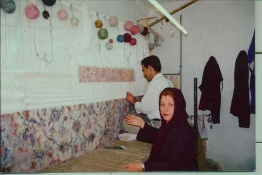 Here you can see a weaver working on a large Tabriz Persian rug. Typically, several people will work on a large Persian carpet as a team and it is not uncommon to have up to 6 weavers producing one Tabriz rug. Most other types of large Persian carpets like the Nain rugs and Qom rugs that are also made in teams.